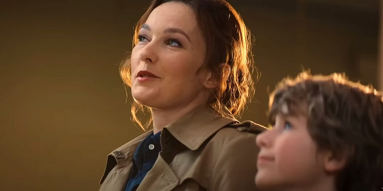 Young Percy Jackson standing next to Virginia Kull as Sally Jackson in the Percy Jackson Disney+ TV show