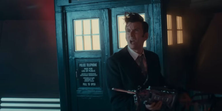 David Tennant as the Fourteenth Doctor in the 2023 Children In Need holding a Dalek's arm and looking confused