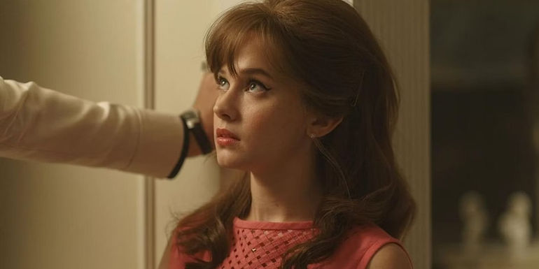 Cailee Spaeny looking up in Priscilla