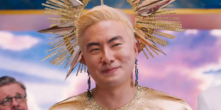 Bowen Yang as God in Dicks: The Musical