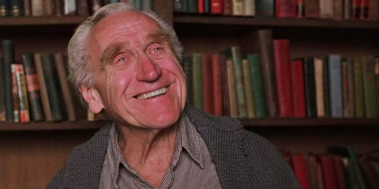 Brooks smiling in the library in The Shawshank Redemption.