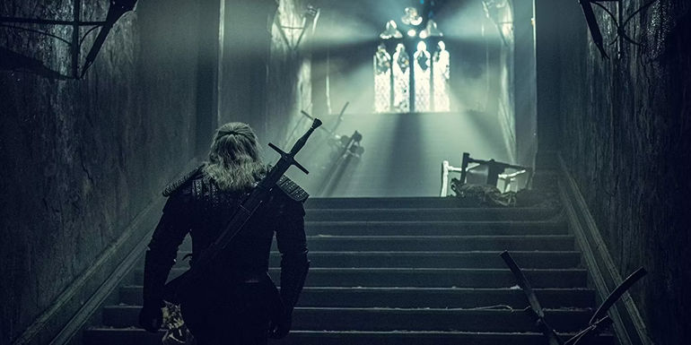 Geralt walking up stairs in The Witcher