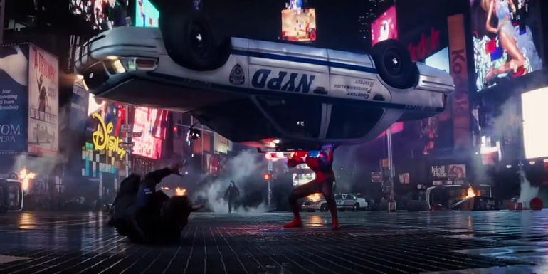 Andrew Garfield as Spider-Man lifting a cop car above his head in The Amazing Spider-Man 2