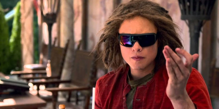 Douglas Smith as Tyson wearing sunglasses and holding up his hands in Percy Jackson: Sea of Monsters