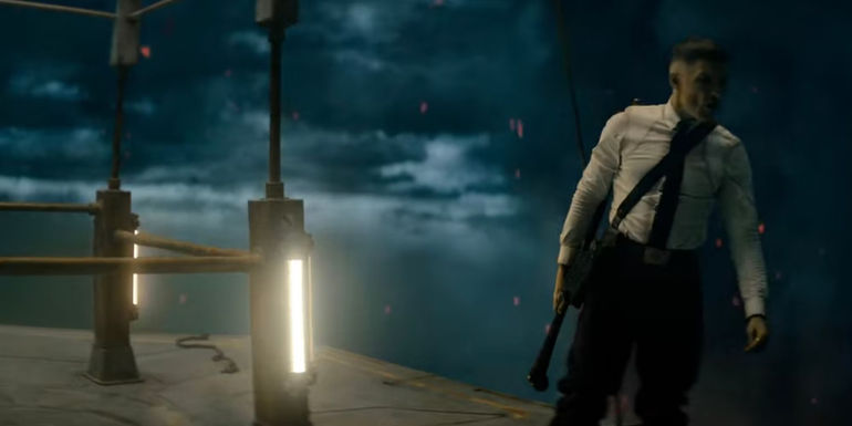 Ed Skrein looking over the edge of a platform as Admiral Atticus Noble in Rebel Moon: Part One - A Child of Fire