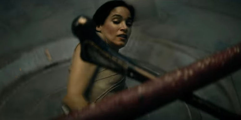 Sofia Boutella as Kora narrowly avoiding being hit by a staff in Rebel Moon: Part One - A Child of Fire