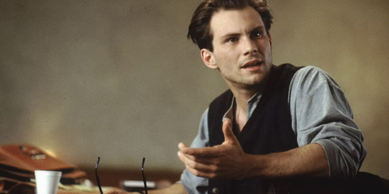 Christian Slater as Daniel Malloy turnig in his chair upset in Interview with the Vampire.