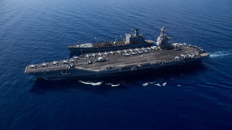 The title: US Navy's Massive Aircraft Carrier Returns to the US following Extended Deployment in the Mediterranean