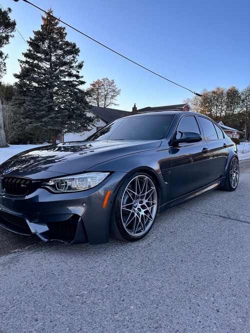BMW M4 ceramic coating — mirror-like reflections after detailing