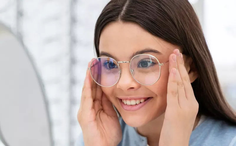 Woman wearing eyeglasses with clear, corrected vision