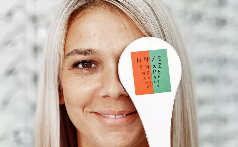 Woman undergoing a vision test during a comprehensive eye exam