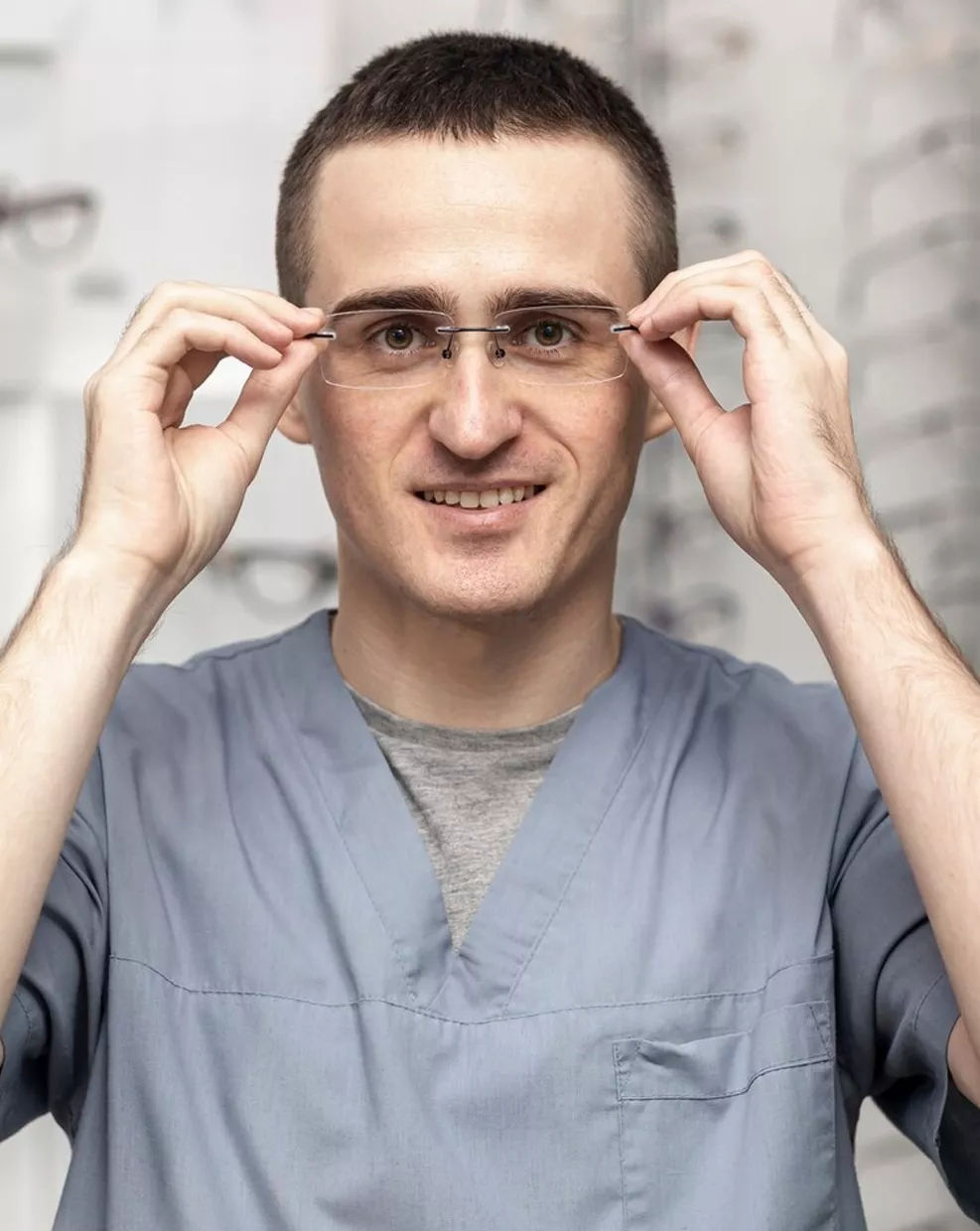 Man adjusting eyeglasses for a comfortable fit at Clear Perspective EyeCare in Albuquerque, NM