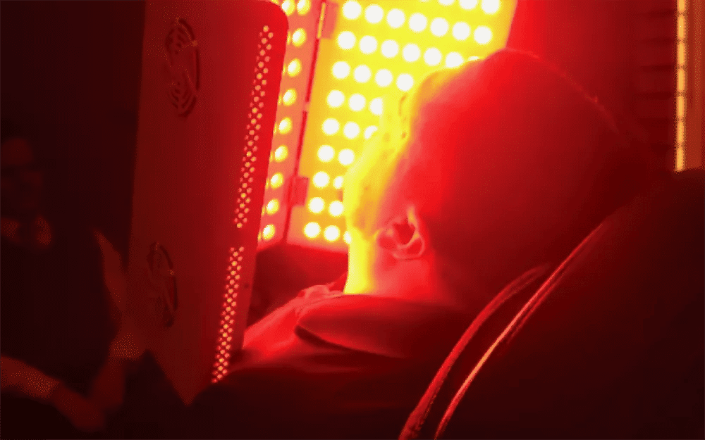 Patient receiving low-level light therapy (LLLT) for dry eye treatment