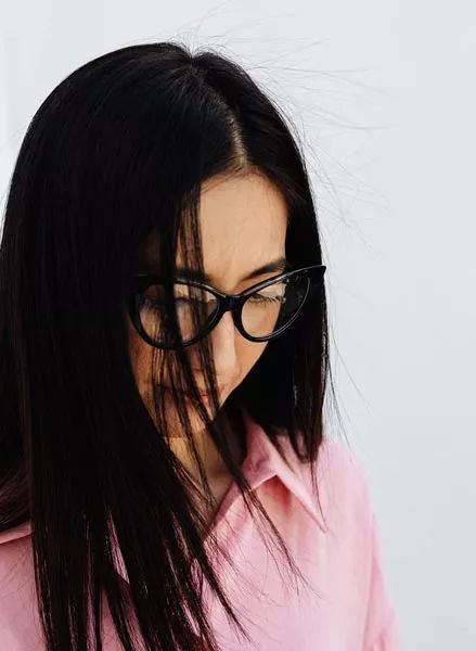 Woman wearing stylish black eyeglasses from Clear Perspective EyeCare