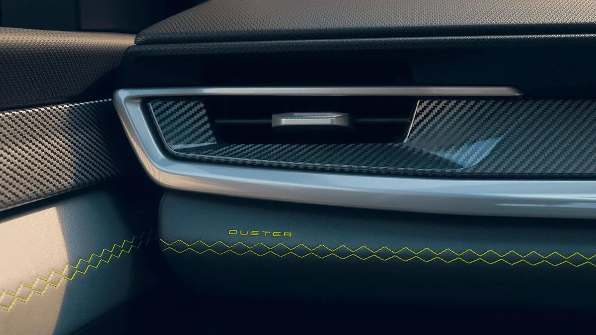 Iconic Upholstery with Duster Emblem & Contrast Yellow Stitching