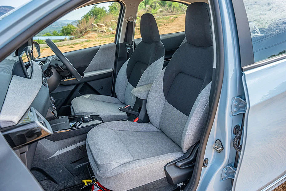Ergonomic Sculpted Fabric Bucket Seats with Height-Adjustable Driver Seat