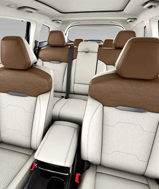 Plush Dual-Tone White & Black Perforated Leatherette Upholstery with French Twin-Stitching