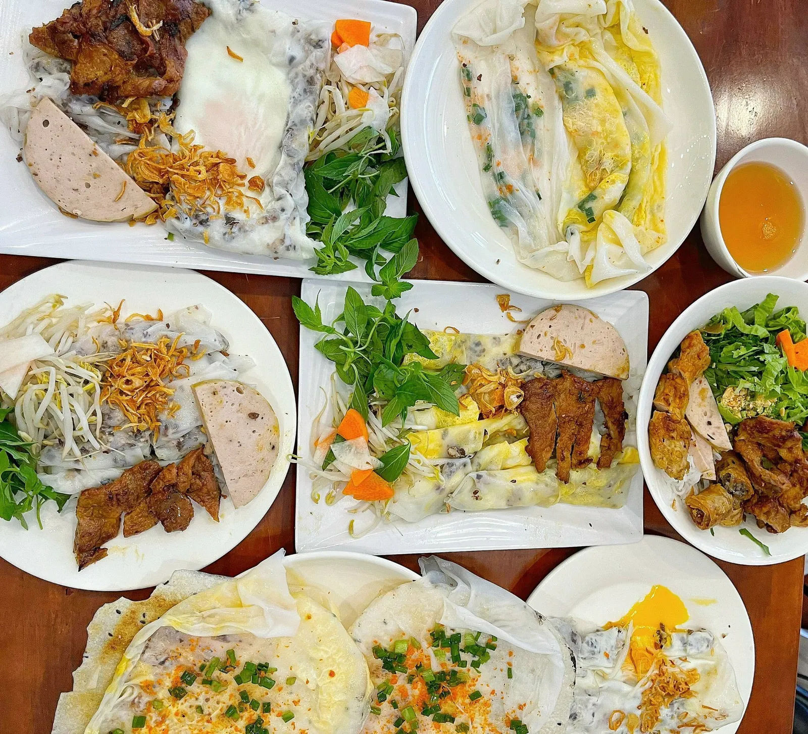Overhead spread: steamed sheets, chả, grilled pork, egg and a grilled cracker