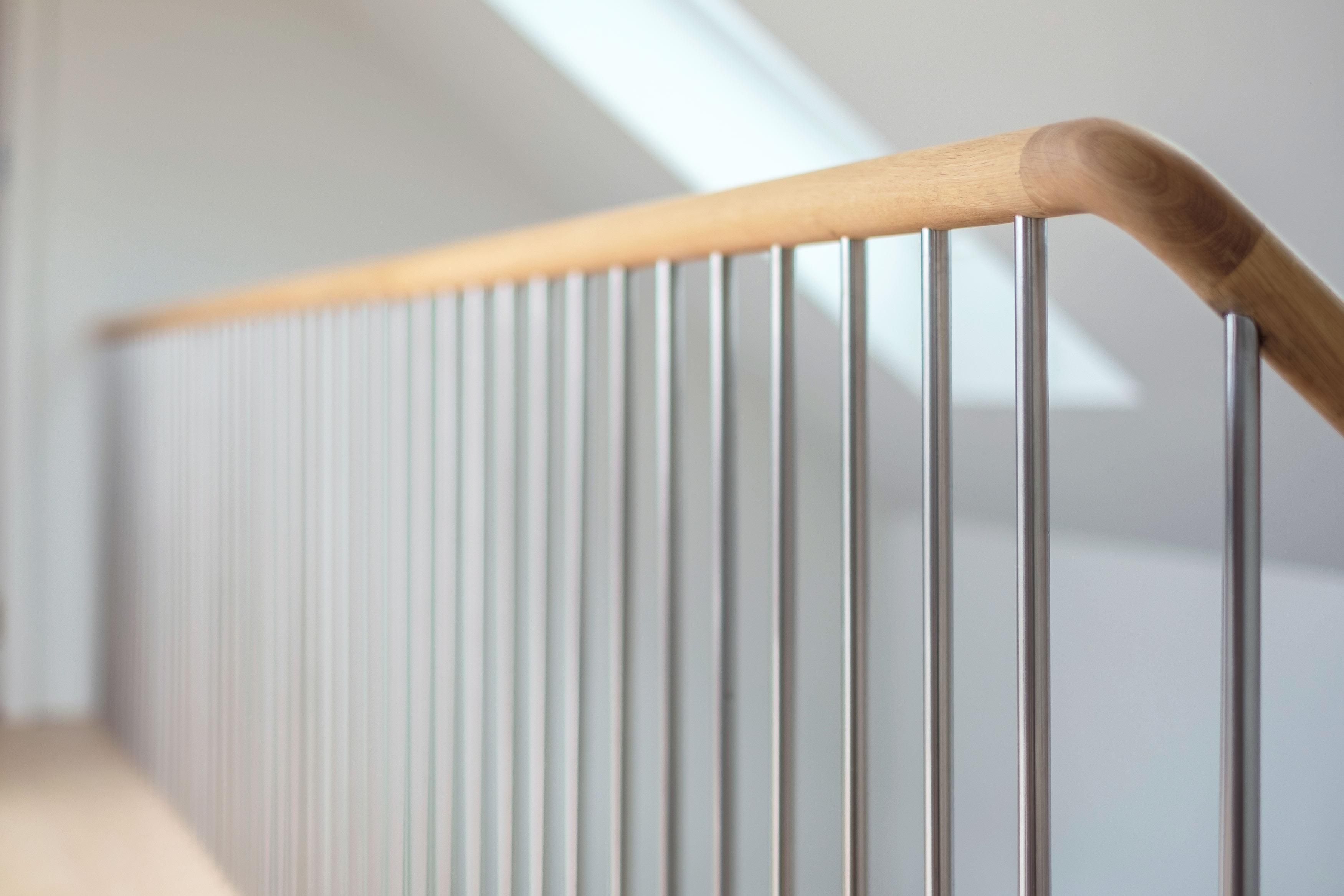 Stainless steel balustrade with round oak handrail.