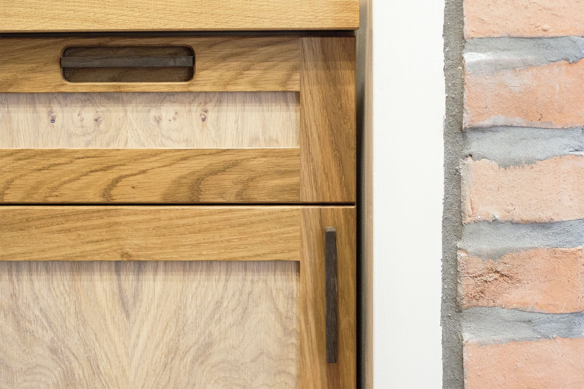 Oak bookcases and cabinets with pippy oak veneered doors.