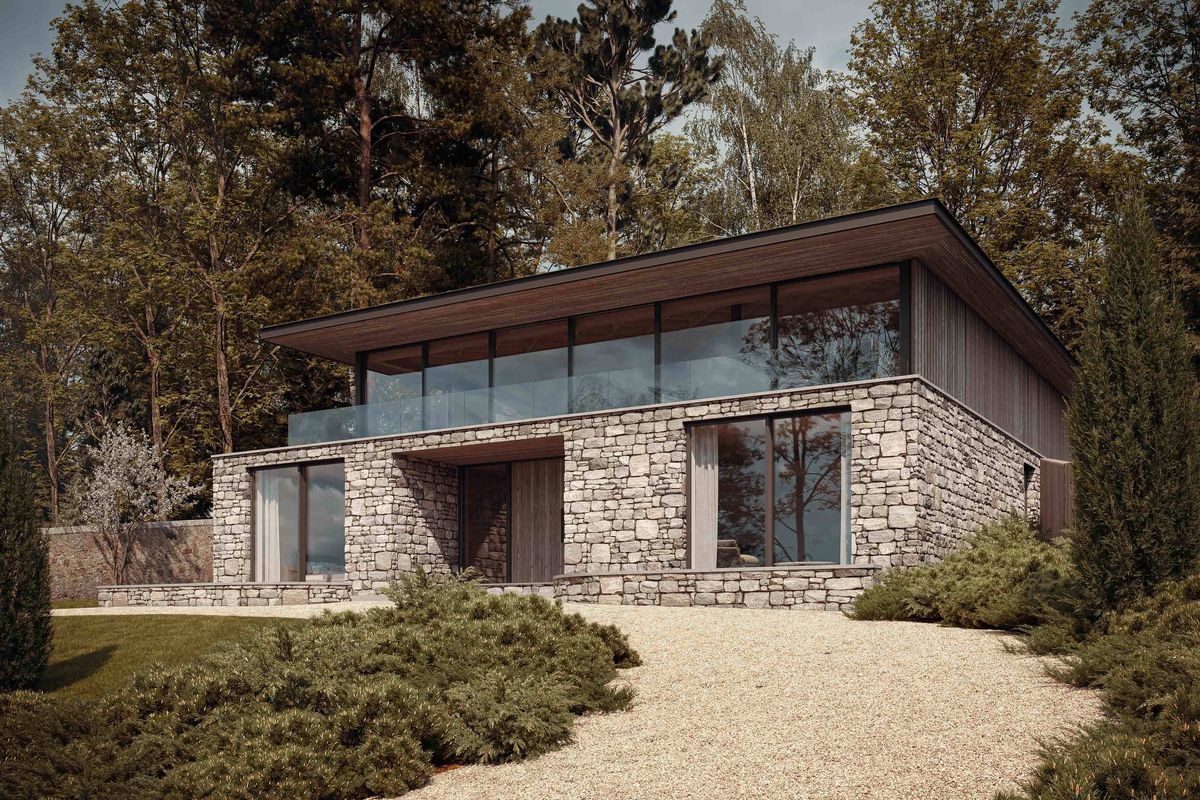 A modern home made from timber and glass, with a sedum roof. Vertical timber cladding covers the house, with floor to ceiling glazing and mature woodland.