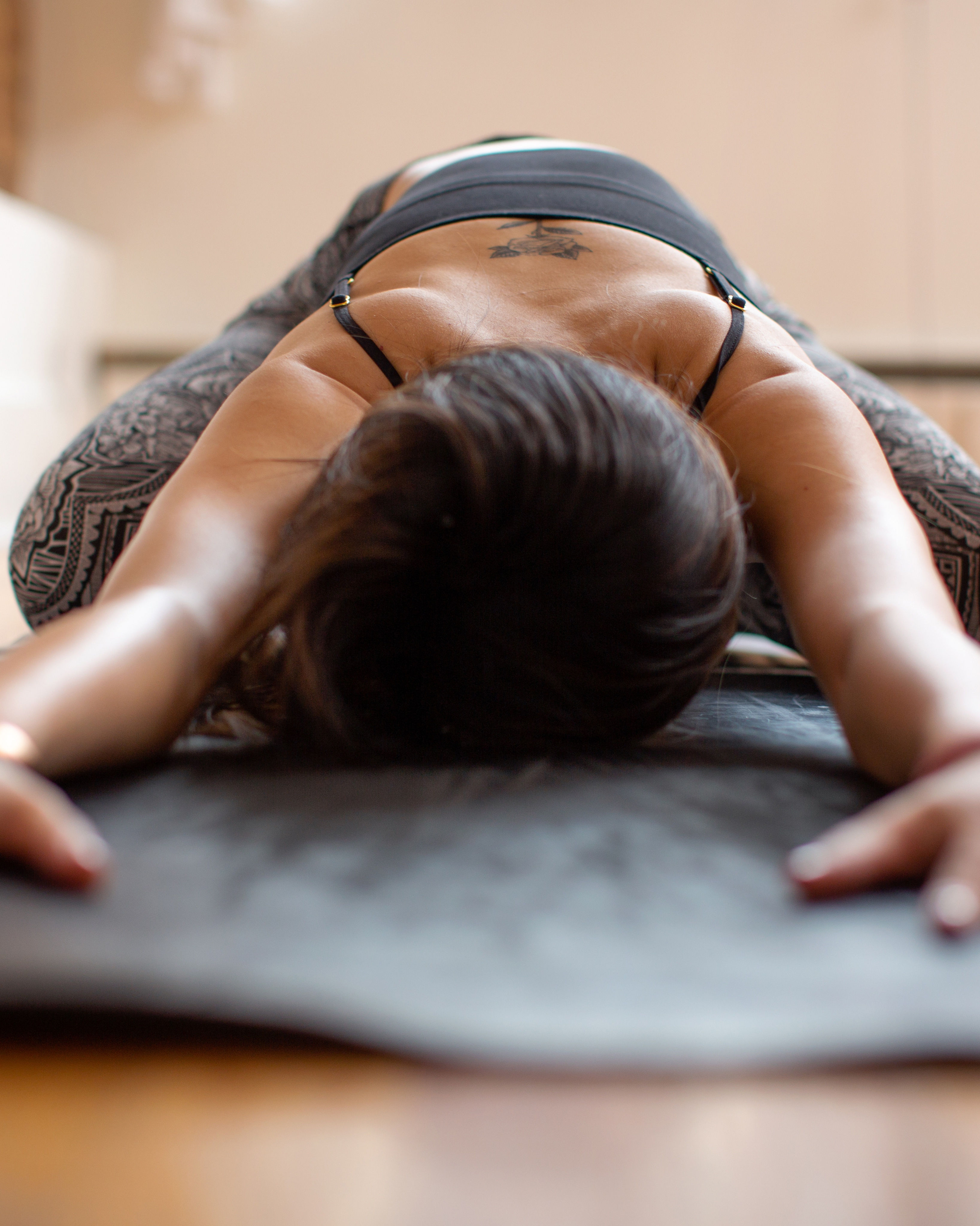 Student in a long-held Yin Yoga posture at World Yoga Training