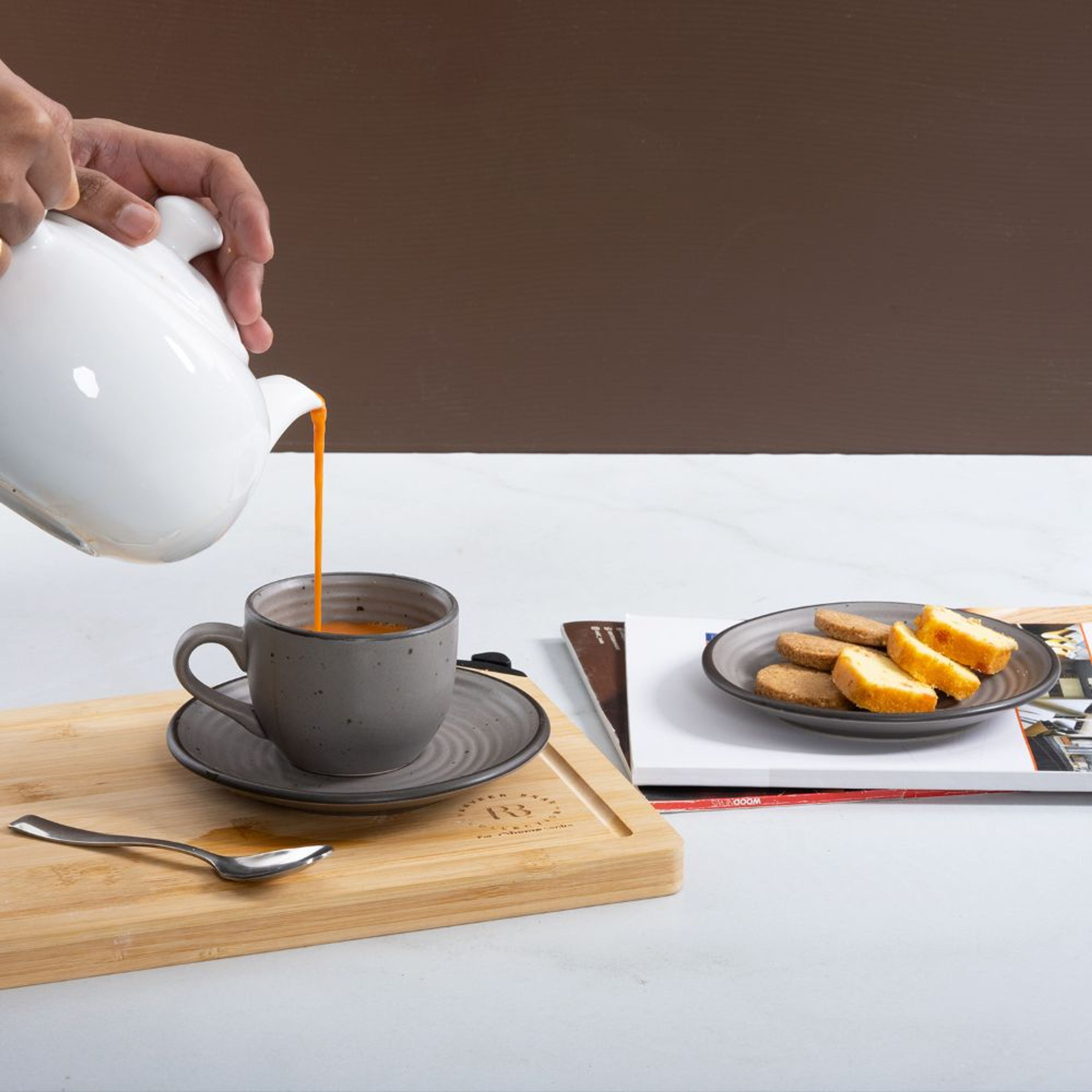 White and orange Feat cups and saucers set