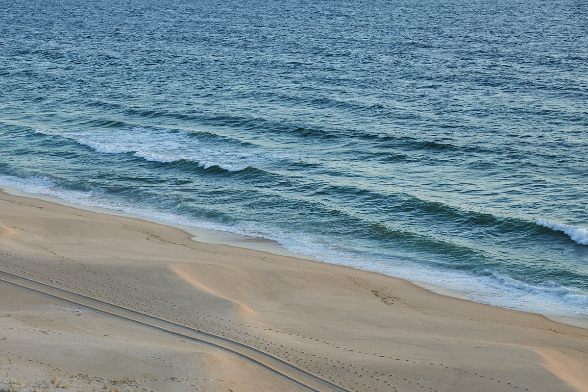 Empty Atlantic beach below the dunes