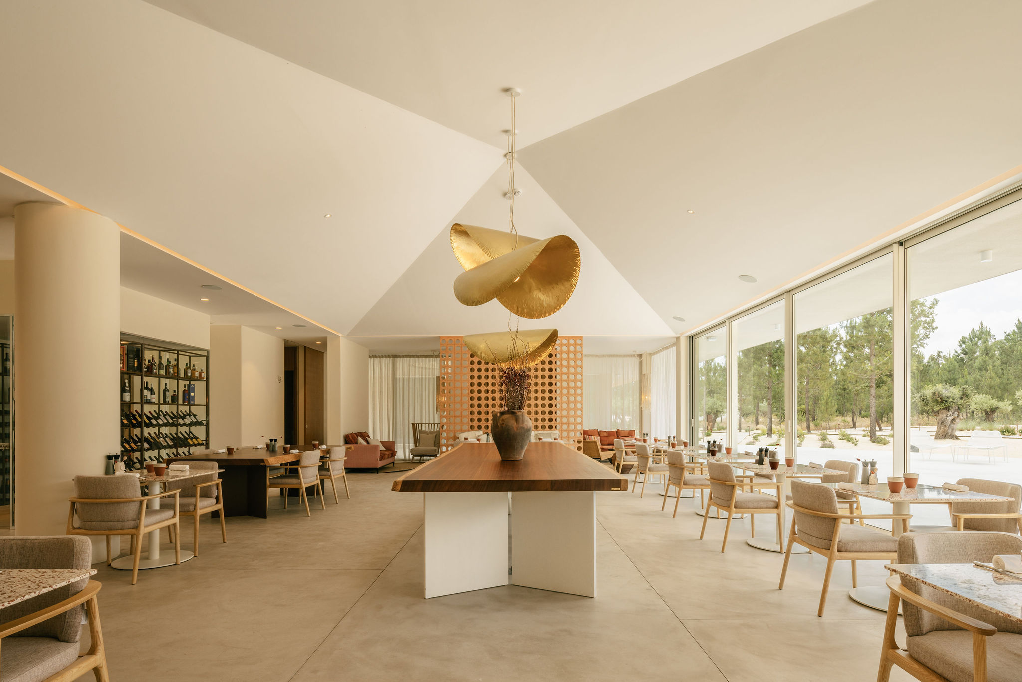 The restaurant at dusk, rattan pendants aglow