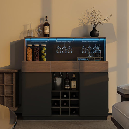 Dark bar cabinet with blue interior lighting holds bottles, hanging glasses, and a central wine rack