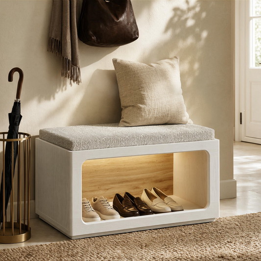 White entryway bench has a gray cushion and open shoe compartment