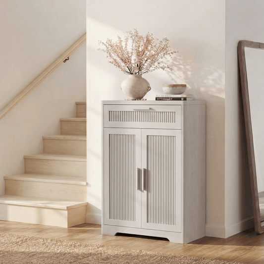 White cabinet has one slatted drawer above two slatted doors