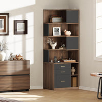 A tall asymmetrical storage unit has several open shelves, three drawers, and one narrow lower cubby