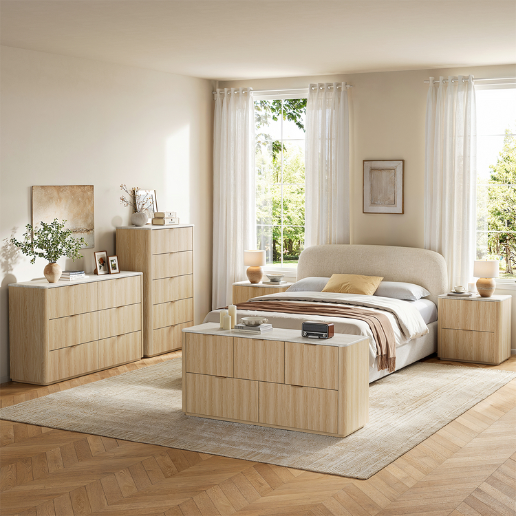 Light wood-toned bedroom furniture shown in a bedroom