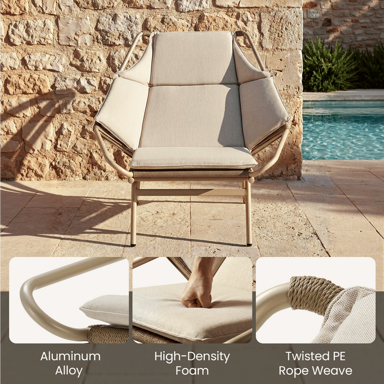Cushioned outdoor armchair has a pale tubular frame and rope-wrapped side sections