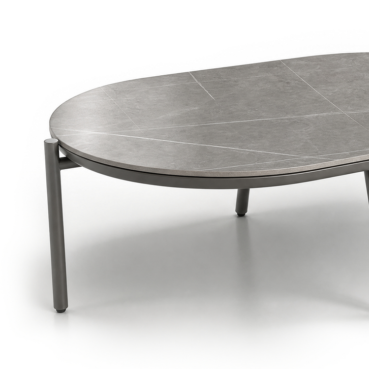 Low round gray coffee table shown against a plain background