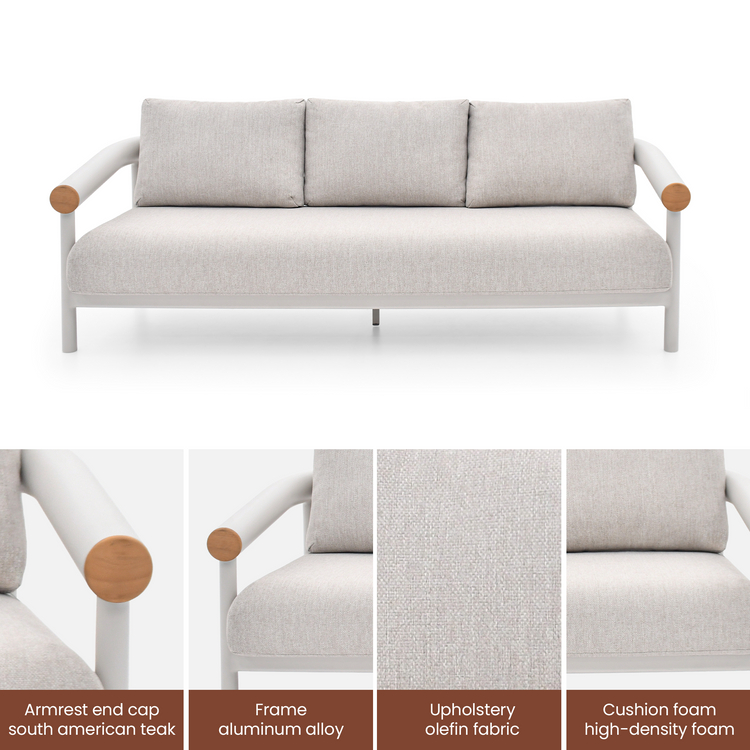 A three-seat sofa has a pale tubular frame, three back cushions, wood-toned arm caps, and four detail panels