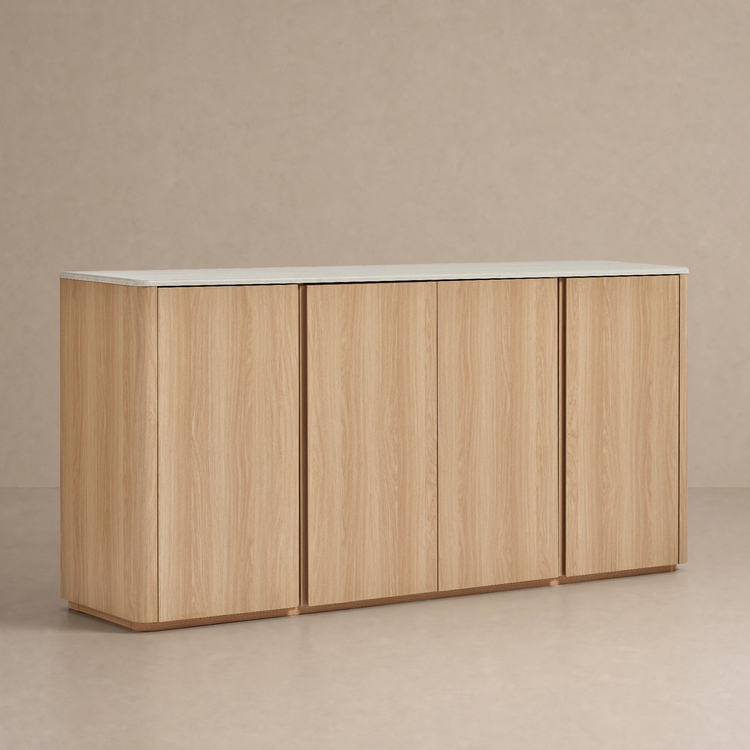 Light wood-grain four-door cabinet with rounded outer corners and a pale slab top