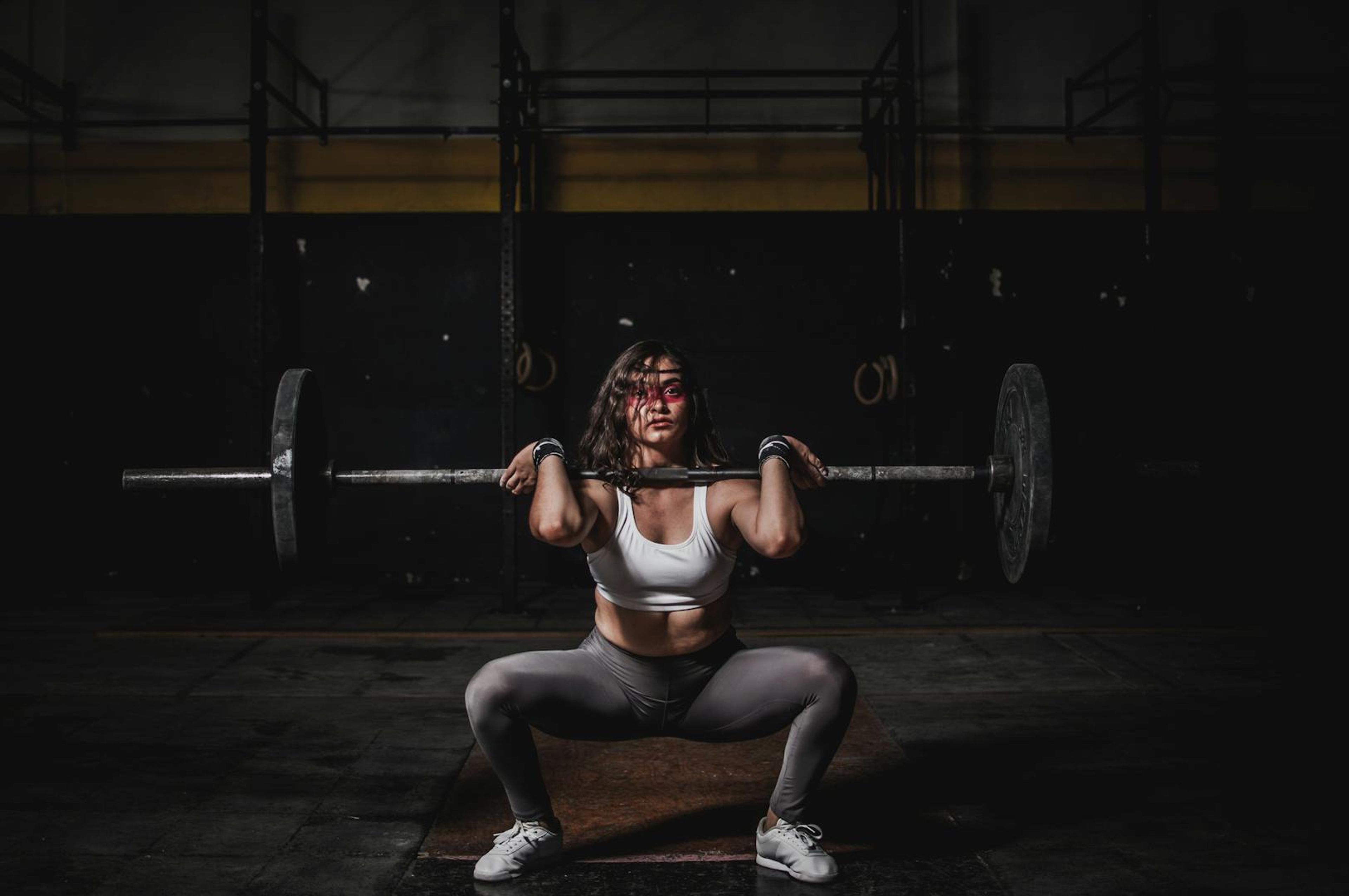 Man lifting dumbbells in a gym