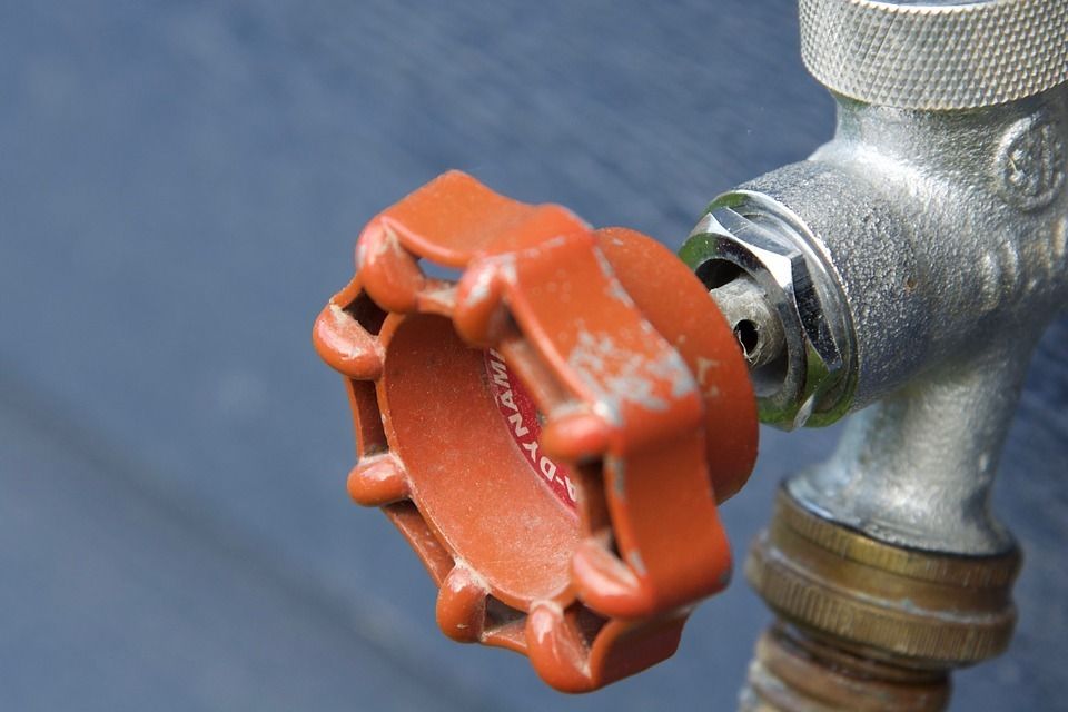 Gas and water line plumbing pipes.
