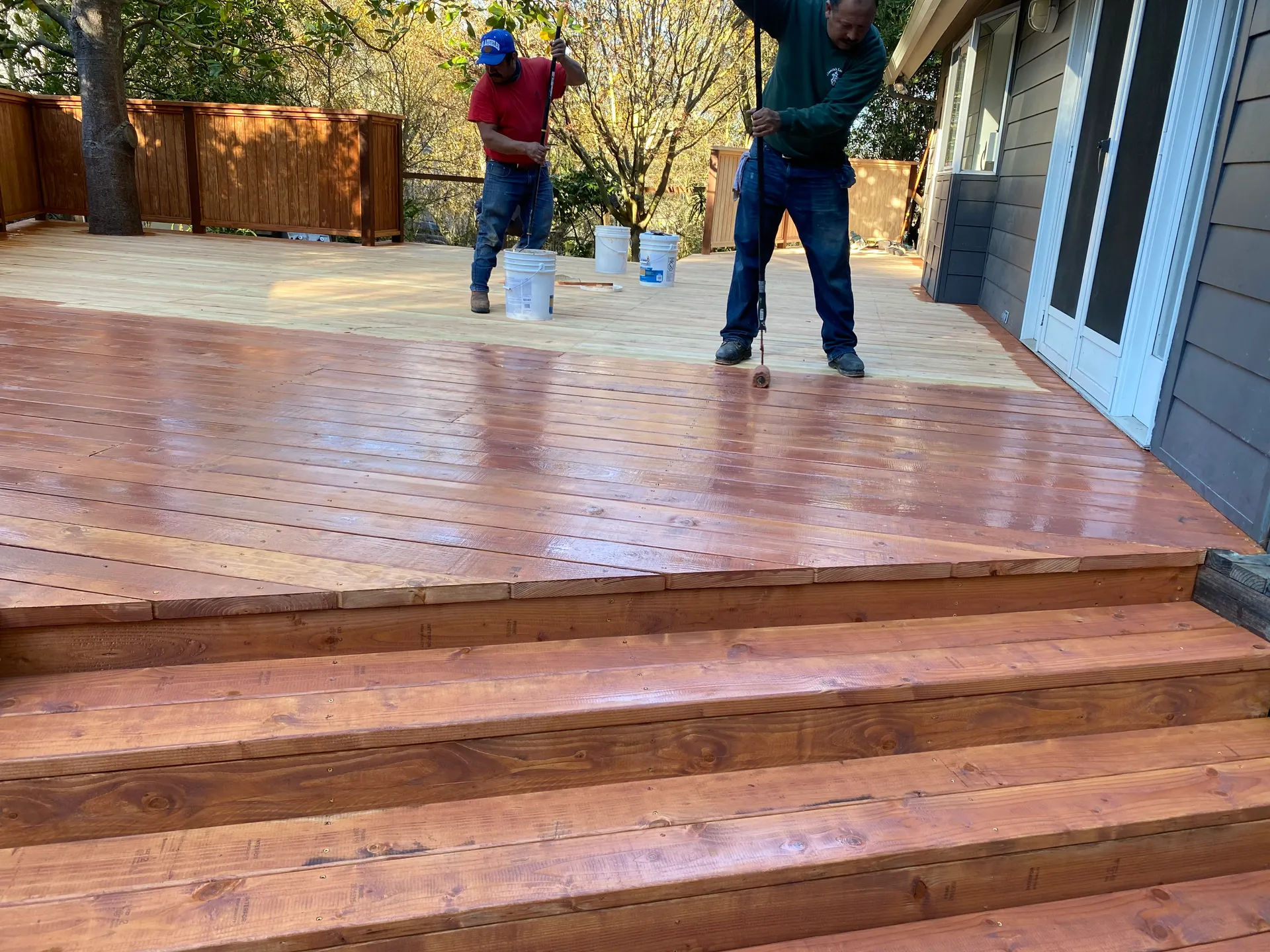 Custom wood deck finishing work by Garcia's Landscaping