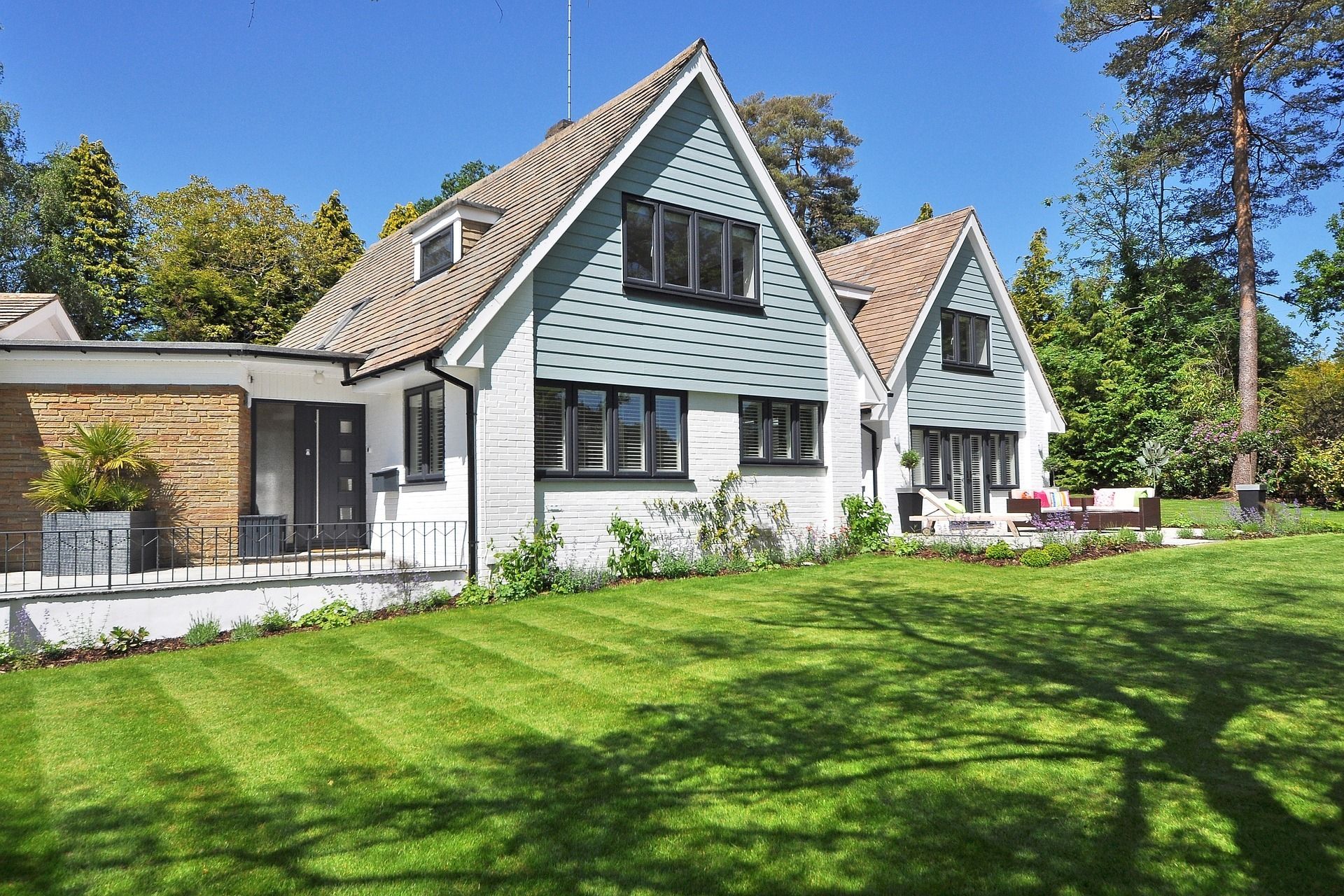 Residential front yard with manicured lawn and landscape