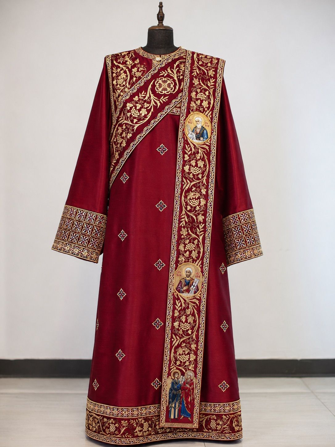 An Orthodox deacon vested in sticharion and orarion, standing at the doors of the iconostasis during a litany.
