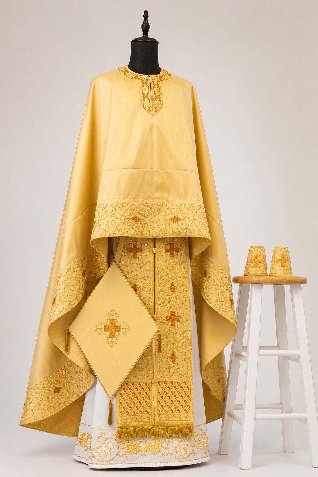 Embroidered Orthodox vestments on a wide shoulder hanger, stored properly between feasts.