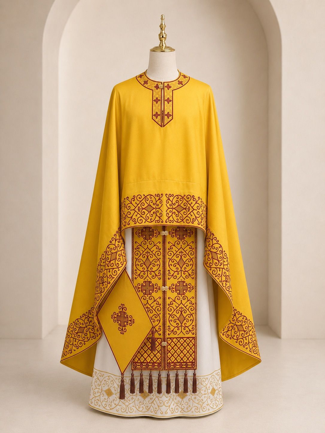 Three Orthodox vestments side by side: deacon's sticharion, priest's phelonion, bishop's sakkos.