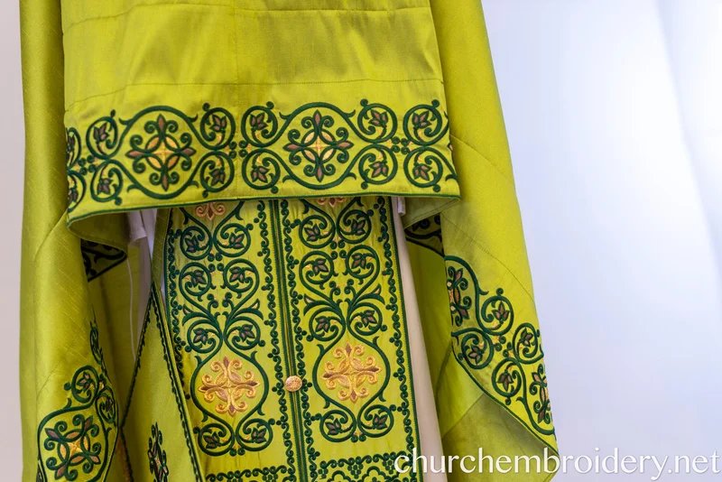 Lime green Greek-style priest vestment set with dark green scrollwork embroidery, gold cross motifs, matching belt and orarion with gold fringe