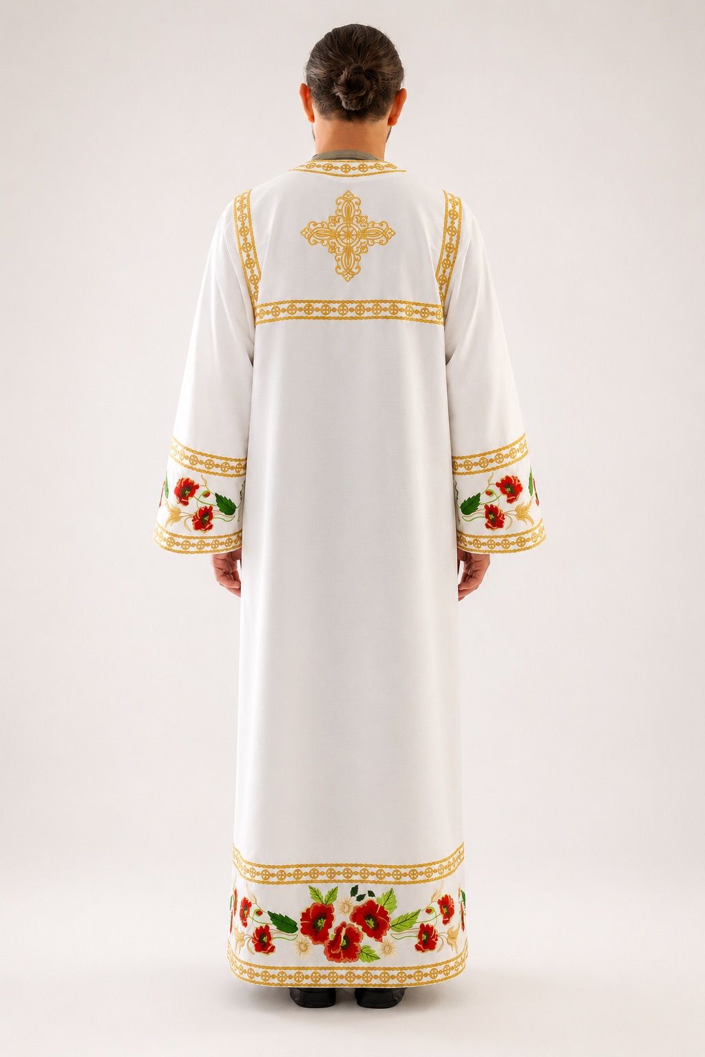 Altar servers in matching sticharia beside the holy doors during the Divine Liturgy.