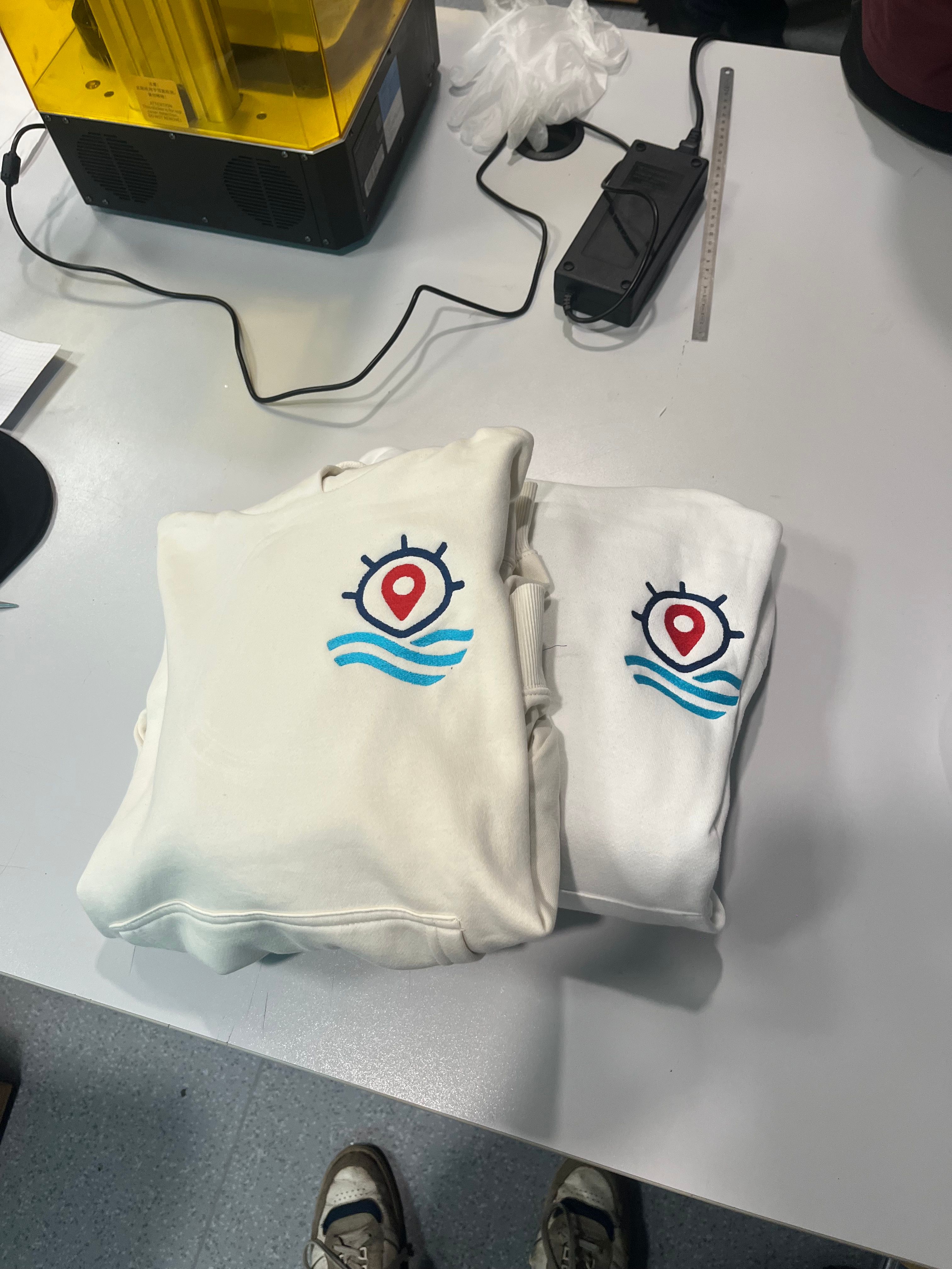 Embroidered logo on white sweatshirt using a PR680W machine