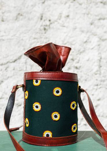 Handcrafted leather potli bag with bold colourful eye embroidery