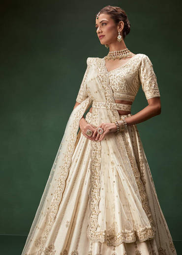 off-white-bridal-lehenga-set-with-boat-neck-blouse-and-regal-zari-work-sg316127-1_611ea0ca-6439-487d-93a8-cbc8b3a9ca3e.jpg